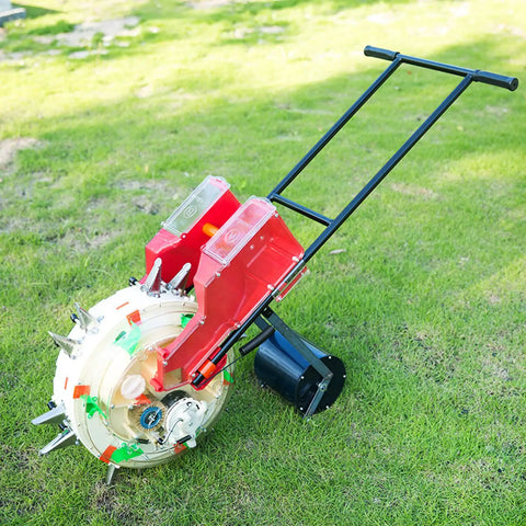 2 In 1 Manual Seeder and Fertilizer Applicator Hand Push Garden Seeder with dual buckets on green grass