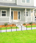 Front view of installed Rustproof Metal Garden Fence Panels No Dig 10 Pack Decorative Border Fencing in front of a house.