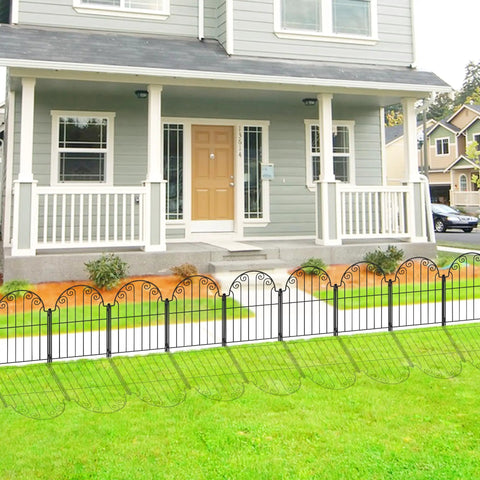 Front view of installed Rustproof Metal Garden Fence Panels No Dig 10 Pack Decorative Border Fencing in front of a house.