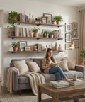 Living room with Industrial Black Iron Pipe Shelf Brackets supporting wooden shelves decorated with plants and books.