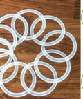 10 Pack Wide Mouth Platinum Silicone Sealing Rings Gaskets For Mason Jar Lids Leak Proof And Air Tight Reusable Seals Durable Fits 3 Inch Wide Mouth Jars For Fresh Food Storage And Easy Preserving, 10 reusable 3-inch silicone rings on wood
