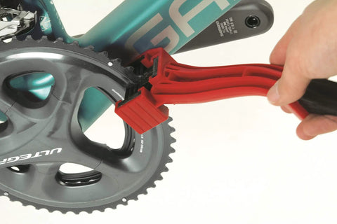 Grunge Brush Bike Chain And Gear Cleaner With Dual Sided Bristles cleaning a bicycle chainring