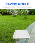 Path Maker Paver Mold For Garden on grass near a stone path, reusable design for antique walkways, durable white plastic