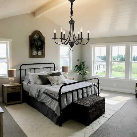Six Light Black Farmhouse Chandelier With Industrial Modern Vibe Candle Style Hanging Light Fixture in a bedroom setting
