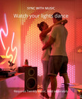 Couple dancing in room with Dots LED String Lights An App Controlled Flexible Color Changing Mood Decor With 60 RGB Segments 200 LEDs Across 33 Feet On Black Wire USB Powered Indoor Smart Home Lighting For Everyday Vibes on wall