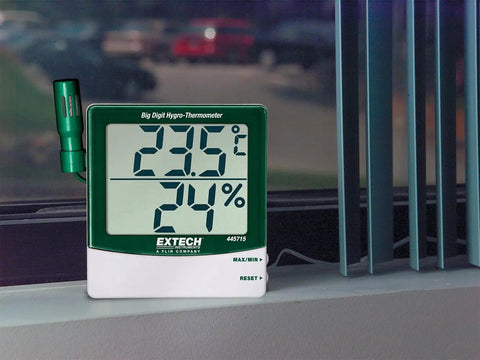Big Digit Remote Probe Hygro Thermometer with dual display showing temperature and humidity readings on a windowsill