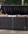 92 Gallon Resin Deck Box in dark gray for outdoor storage, lid open showing patio cushions, on a patio with text annotations.
