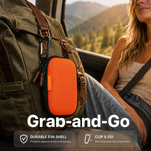 Solid Orange Mini Hard Shell Earbud Case Portable Rectangle Carrying Pouch clipped to a backpack for secure travel.