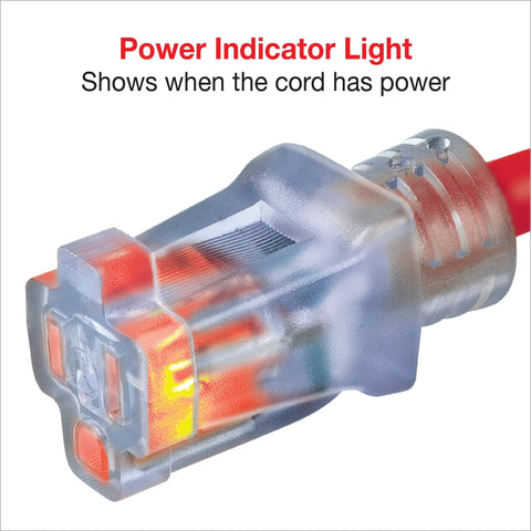 Close-up of Workhorse Heavy Duty Outdoor Extension Cord 50 Feet Pink with lighted connector showing power indicator light.