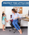 Woman in office holding toddler near a door with "3 Pack Kidproof Toddler Door Lever Lock For Easy One Hand Operation" sign.