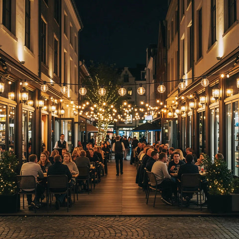 Outdoor String Lights 150 Ft G40 LED Patio Lights Plug In Waterproof Connectable Globe Bulbs 75 E12 Warm White 2700K Perfect For Cafe Backyard Porch Balcony Decor illuminating a night cafe setting with dining tables under warmly lit street.