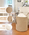 Tall Woven Laundry Basket for Living Room and Bedroom, Boho Farmhouse Round Wicker Blanket Basket for Towels and Clothes, Jute Laundry Hamper with Wooden Bead Tassel, Chic Home Decor 15 by 17.7 Inches in room setting with soft material and bead details.