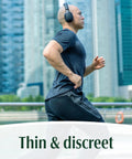 Man jogging in grey with headphones, displaying Fresh Protection Maximum Absorbency Incontinence Underwear For Men, Large, 35-43 inches.