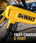 Yellow DeWalt tool with fast-charge C port on a job site.