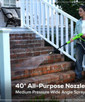 Woman using Ultra Compact 1700 PSI 1.2 GPM Pressure Washer for Quick No Fuss Home Cleaning and Patio Care on brick stairs