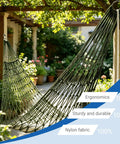 Breathable Mesh Hammock With Nylon Net For Easy Setup Rope Style Hang Loose Outdoors 98 X 31.5 Inches 100 Kg Capacity Perfect For Camping Backyard Tree Hanging Olive Green shown in garden setting