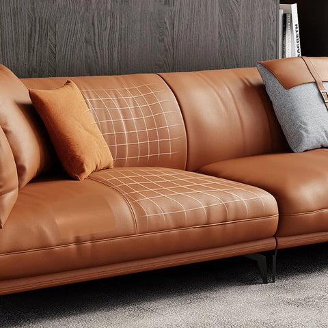 Heavy Duty Leather Repair Tape Kit That Delivers A Dang Sure Fix Easy Peel And Stick Couch Patches For Scratches Scuffs And Tears No Sew Brown 8.2 By 11 Inch 2 Pack applied on a brown leather couch.