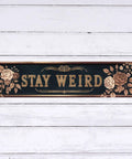Snag This Sick Vintage Metal Tin Sign Keep It Weird Wall Decor Plaque 4x16 inches with floral design on dark background.