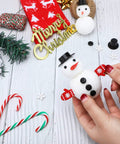 Massive Christmas Craft Button Kit With 450 Pieces Including Carrot Noses Tiny Black Buttons Mini Plastic Top Hats Glove Buttons And White Snowflake Buttons For DIY Ornaments And Holiday Decor.