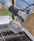 Person using Triple Coil Grill Brush 17 Inch Stainless Steel Bristle Free Scraper For All Grates With Flexible Coils on BBQ grill