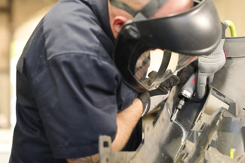 Worker using Beast Power Air Die Grinder with 25,000 RPM and 0.4 HP, 1/4 inch collet for metal grinding with ergonomic grip.