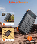 Beast Solar Power Bank 40000mAh Portable Charger With PD 20W on rocks, showcasing IP67 waterproof and dustproof features.