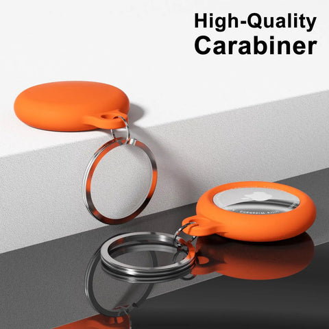 Neon Orange Silicone AirTag Keychain Case With Ring Waterproof AirTag Holder Durable Full Body Cover For Kids And Luggage Car Pet Collar Travel Ready Must Have Anti Fingerprint Dust Proof Lightweight displayed on a surface with attached key ring.
