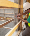 Using Dead On Straight Shooter Laser Distance Meter With 150 Foot Range for measurements in a construction site.