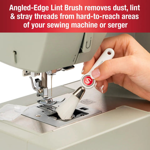Person using angled lint brush from 7 Piece Sewing Machine Maintenance Tool Kit With Needle Inserter, Angled Lint Brush, Threader And 3 Screwdrivers, Universal Compatibility, Handy Storage Pouch, Quick Home Sewing Repairs For Any Project on a sewing machine