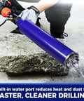 Side view of blue 2-1/2 inch pro core drill bit with water-injection adapter on SDS Plus drill drilling into concrete.