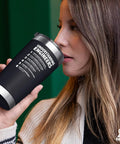Woman drinking from Understanding Engineers Funny Engineer Gifts 20 Oz Vacuum Insulated Tumbler Black Ideal For Engineering Students