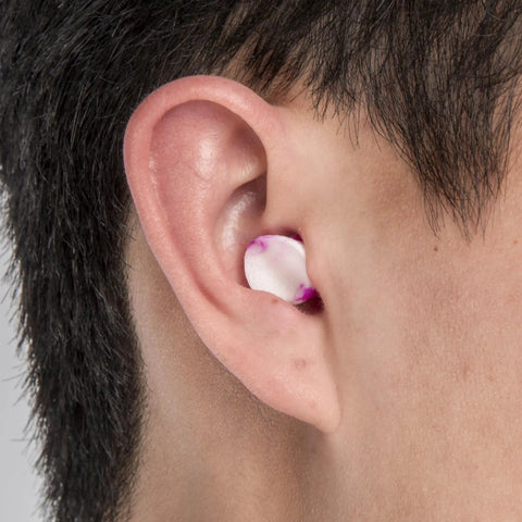 Sparkplugs Disposable Ear Plugs NRR 33 Uncorded, Soft Foam Comfort Fit, shown inserted in ear for easy use