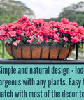 Four Pack Twenty Four Inch Black Metal Railing Planter Boxes With Natural Coco Fiber Liner And Heavy Duty Adjustable Clamps For Quick No Sweat Deck Fence Balcony Patio Garden with blooming flowers.