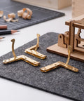 Gold Finish 92 Degree Quadrant Hinges For Jewelry Boxes And Small Cabinets With 8 Hole Iron Bent Corner Folding Lid Hardware 1.42 x 1.18 Inch Heavy Duty Durable Support And Tough As Nails For DIY Craft Projects showcased on tabletop with tools