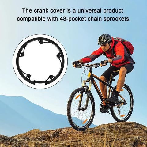 Close-up of bike chain guard protector with 5 holes, shown with mountain biker on rugged terrain; plastic, 48 teeth, universal fit.