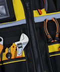 Built Tough Contractor Vest With Roomy Multi Pocket Layout And Easy Waist Adjustments Crafted From Heavy Duty Waterproof Oxford Cloth showing tools in pockets.