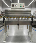 AOXHUGB Heat Shrink Tunnel Machine 4.0 Inch Diameter For Bottle Labeling Pvc And Pof Film Adjustable Speed Up To 32.8 Ft Per Min compact design with bottles on conveyor.