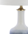 Gradient 25 Inch Ceramic And Brass LED Table Lamp with white shade, featuring navy to white glaze and brass details