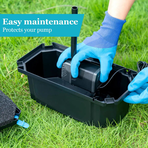 Hands assembling 25W Solar Pond Filter Box With Water Pump, PVC tubing visible, shown on grass for easy install and low maintenance.