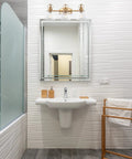 Modern bathroom with Three Light Vanity Bathroom Light With Clear Glass Shades In Warm Brass Finish above mirror, cozy setting