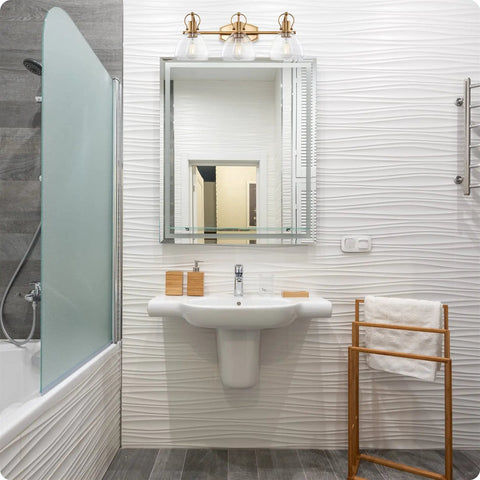 Modern bathroom with Three Light Vanity Bathroom Light With Clear Glass Shades In Warm Brass Finish above mirror, cozy setting