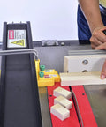 Using Matchfit DS-333 Dado Stop for table saws to cut precise dados on a wooden board, yellow accessory ensures perfect fit.