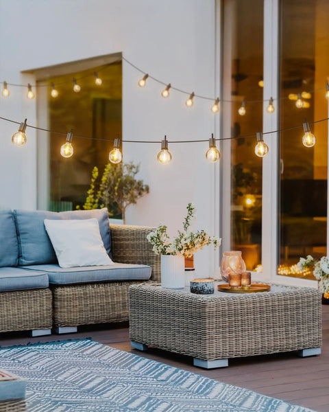 Outdoor String Lights 29 Feet G40 LED Patio Lighting Plug In With 13 Plastic Edison Bulbs And 1 Spare Waterproof Connectable Hanging Lights For Backyard Porch Balcony Parties E12 Base Black beautifully illuminating a patio setting.