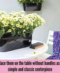17 Inch Black Metal Deck Railing Planter Box 2 Pack Wall Hanging Flower Boxes For Outdoor Garden Window Boxes Fence Rail Buckets With Drainage Holes Modern Boho Style Patio Porch Decor on a table with flowers