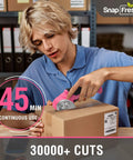 Cordless Electric Scissors For Quick Unpacking And Crafting, used by a young man cutting a cardboard box.