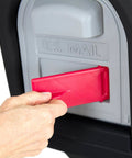 Hand pulling out red flag on Top Grade Classic Black Plastic Residential Mailbox With Standalone Yard Post Mount Combo Kit.