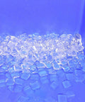Heavy Duty Commercial Ice Maker Kicks Out 1980 Lbs Of Rock Solid Square Cubes Daily showing clear ice cubes in a blue hopper.