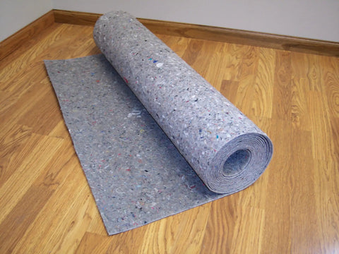 Pro Grade Flooring Underlayment Roll For Laminate Wood And Tile Sound Dampening Padding Compression Resistant Mat For Floating Glue Down Install Covers One Hundred Square Feet in a room.