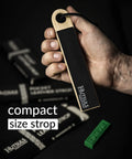 Hand holding Pocket Knife Strop Kit On The Go Sharpening With Leather Strop And Stropping Compound Portable Strop Block