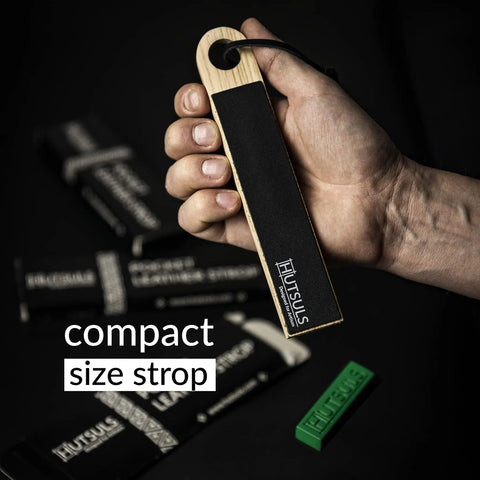 Hand holding Pocket Knife Strop Kit On The Go Sharpening With Leather Strop And Stropping Compound Portable Strop Block